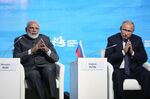 Narendra Modi, India's prime minister, left, and Vladimir Putin, Russia's president. Neither is having a great pandemic.