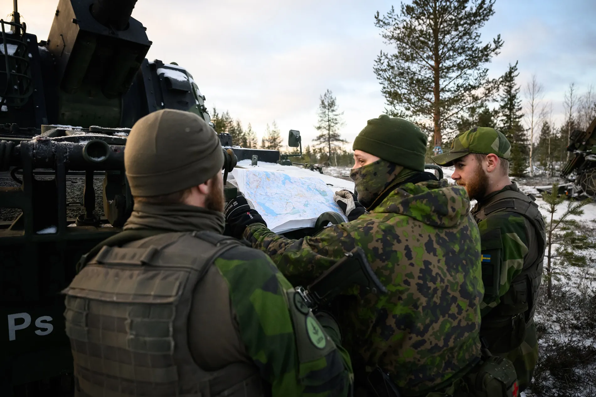 An artillery team&nbsp;consult a map during a NATO exercise near Heinu, Finland, on Nov. 20.