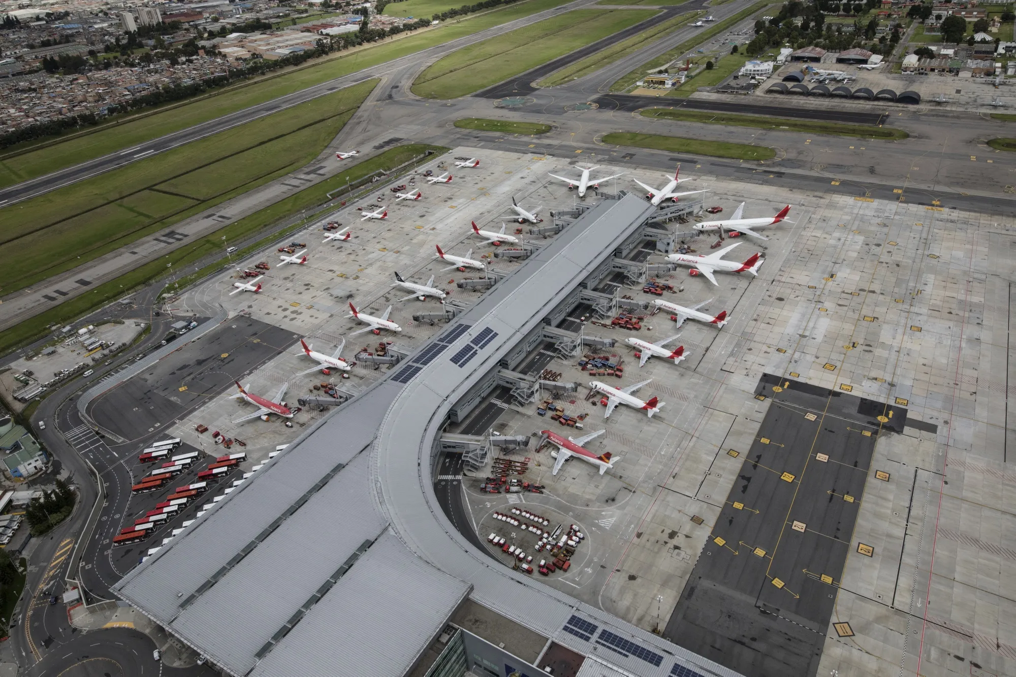 Airplanes sit parked at El Dorado International Airport in Bogota on April 7.