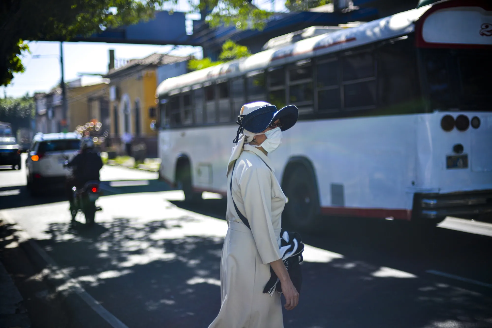 A nun wears a protective mask in front of a National hospital in El Salvador on March 11.